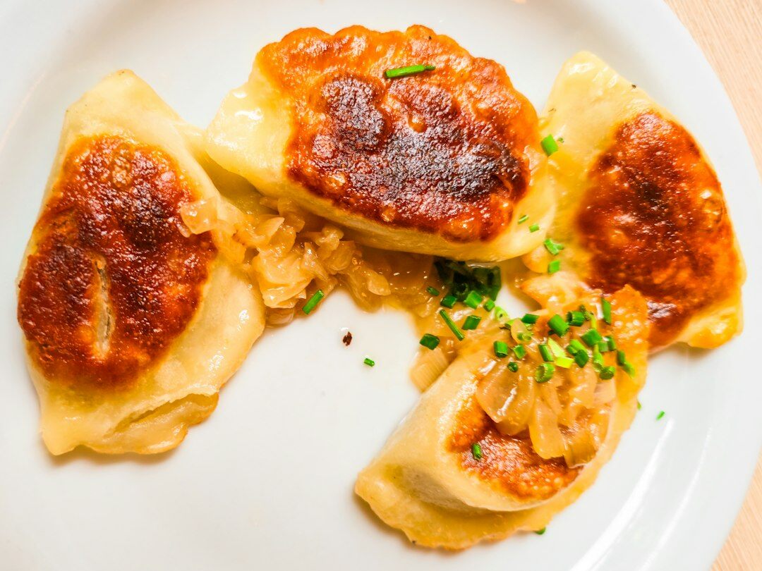 Czech svickova sauce with beef and bread dumplings on a ceramic plate